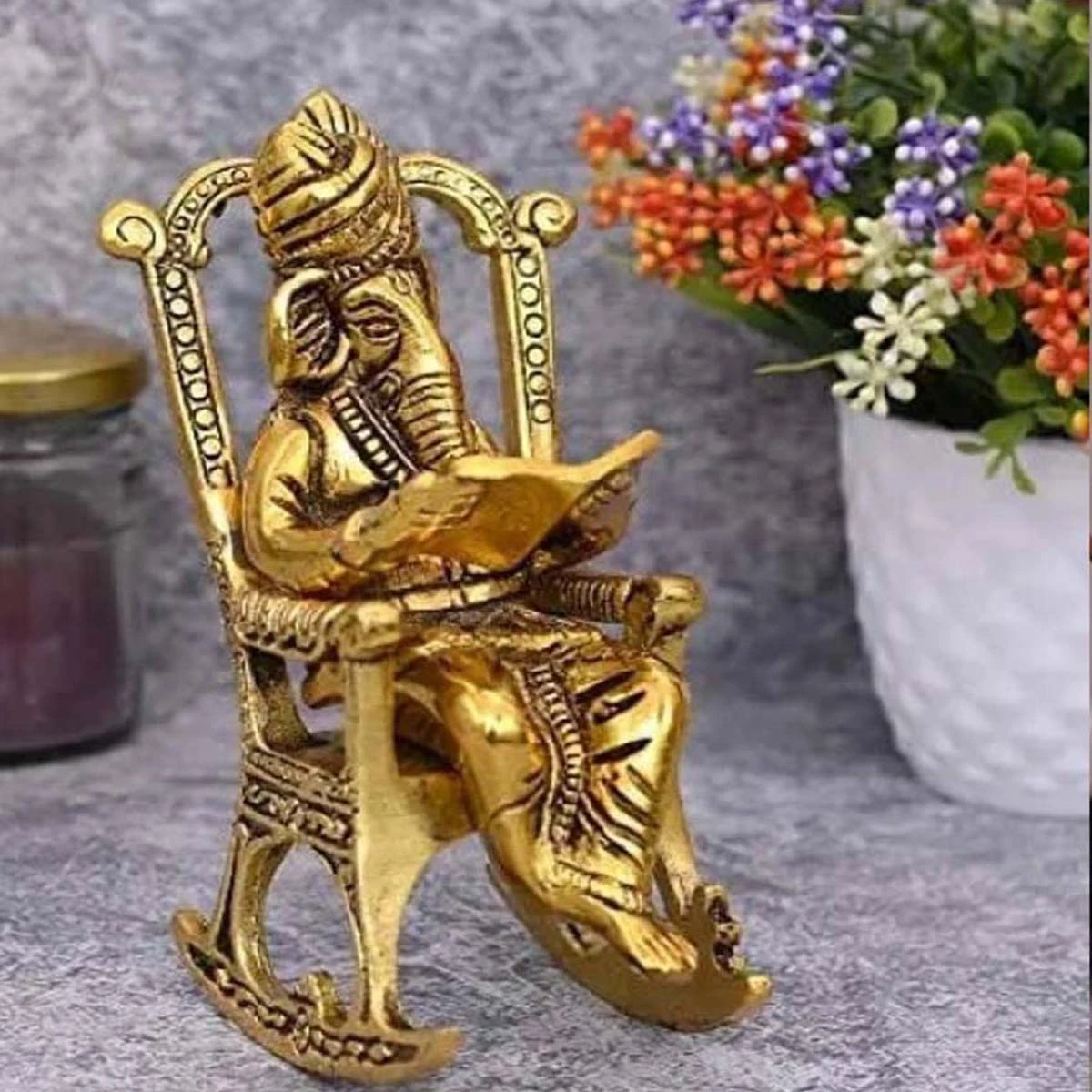 Heaven Decor Lord Ganpati Murti Sitting on Chair Reading Ramayan Idol Sculpture Decorative Showpiece and Gifts.